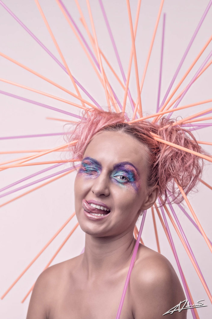 Fantasy photography woman with straws in her hair.