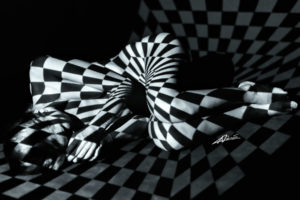 Projections-nude photography woman lying with grey and white rectangles picture.